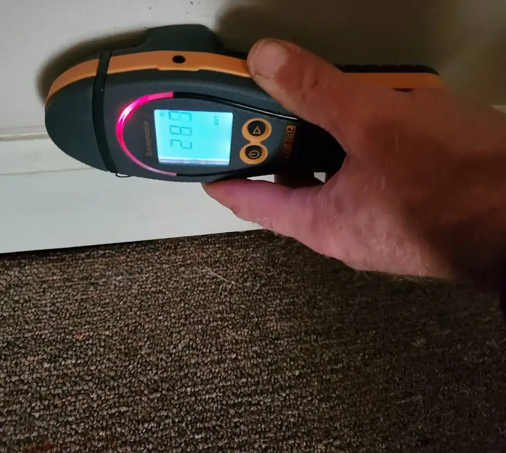 Moisture detection at baseboard during Storm Damage Restoration in Connersville